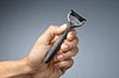 Person holding a Wilkinson Sword razor