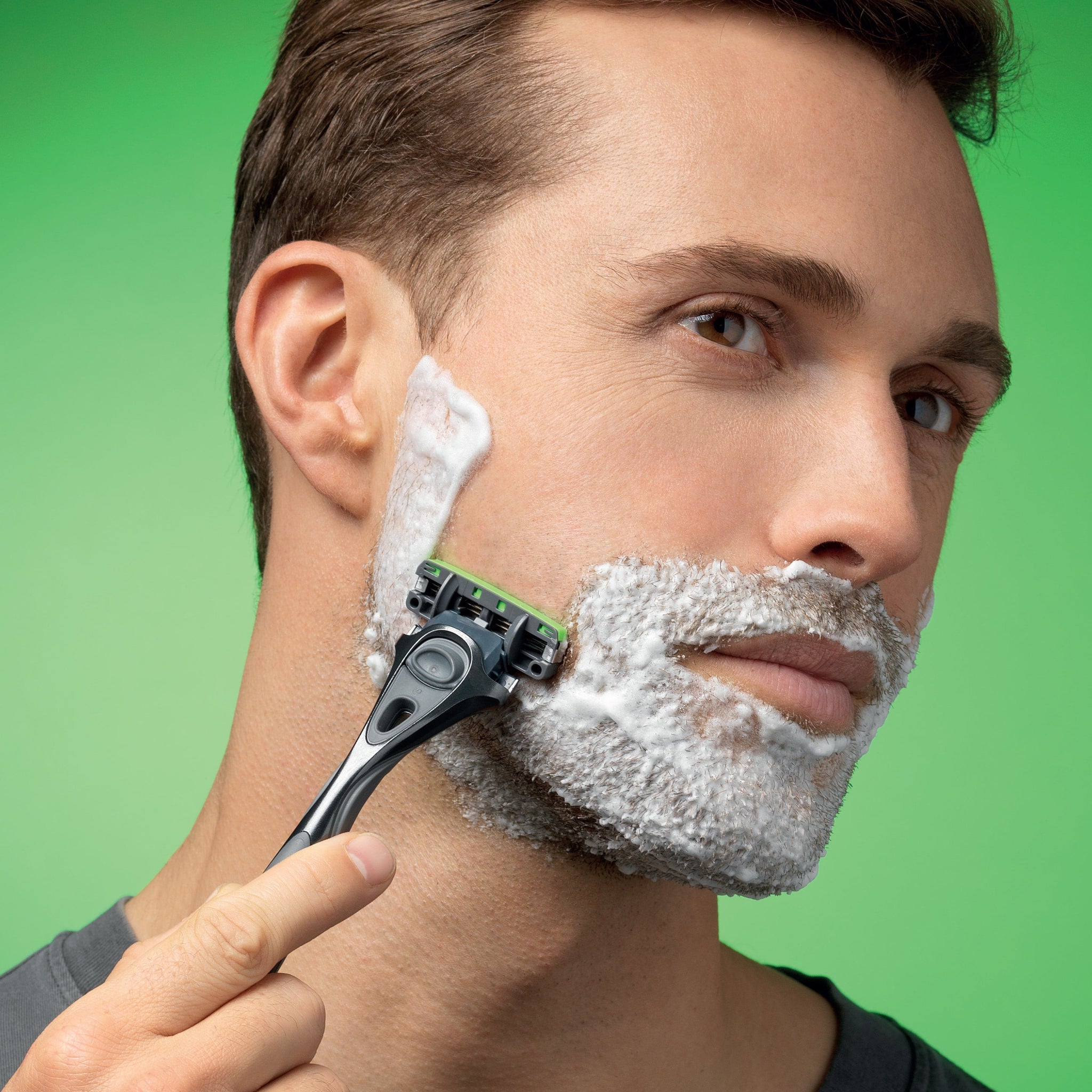 Man shaving with Wilkinson Sword razor