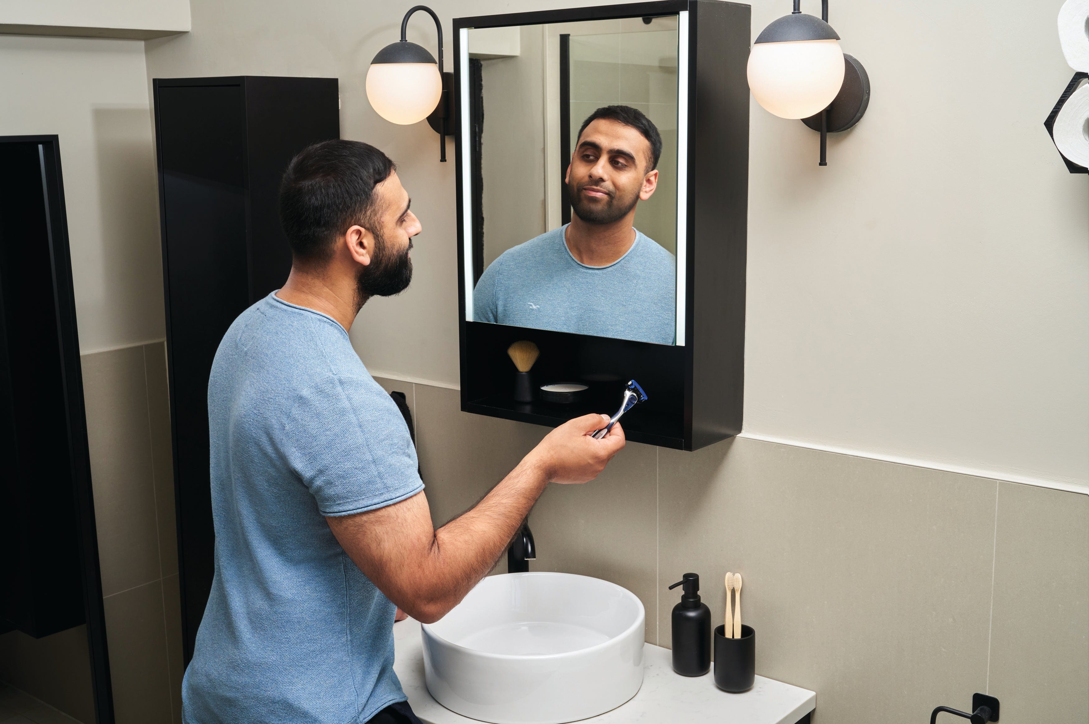 Man with stubble using Wilkinson Sword razor