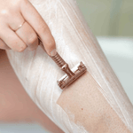 Woman using Intuition Double Edge Rose Gold Razor
