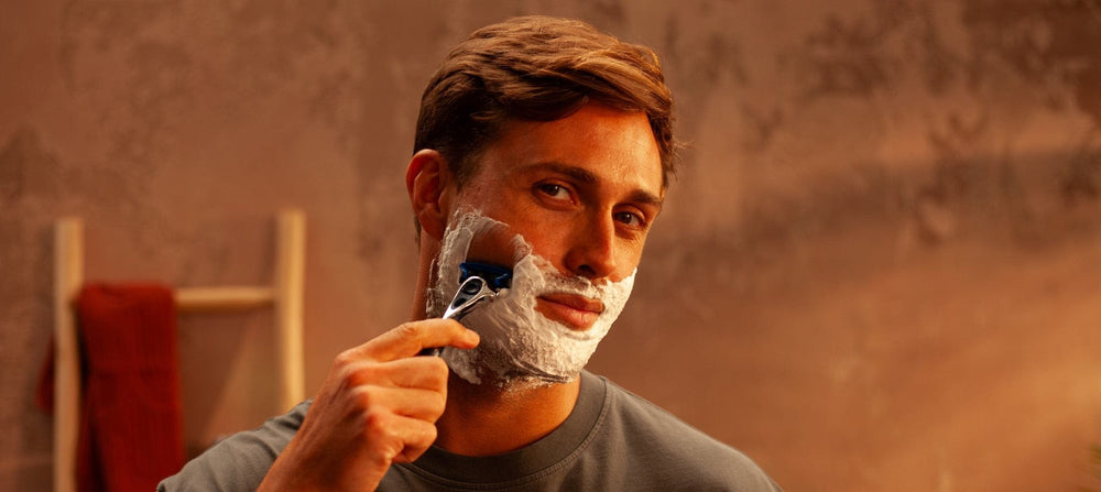 Man shaving his face with Wilkinson Sword razor