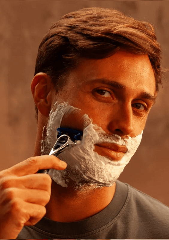 Man shaving his face with Wilkinson Sword razor